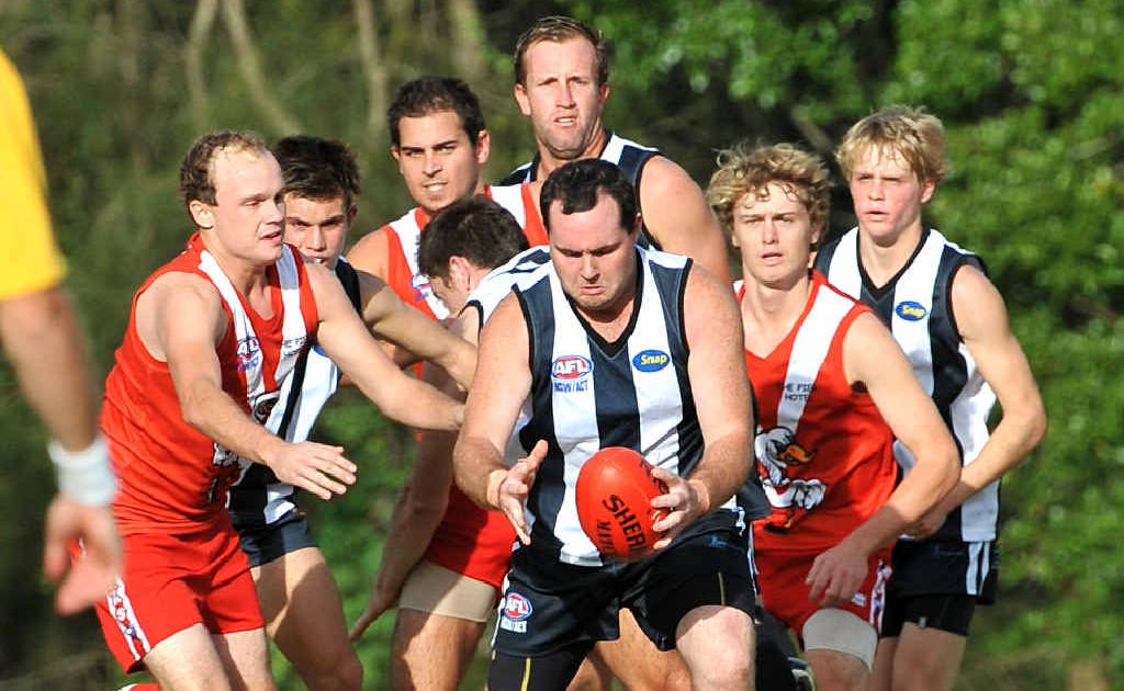 Port Macquarie’s Matthew Lill in action against the Coffs Swans. Port Macquarie’s Matthew Lill in action against the Coffs Swans.